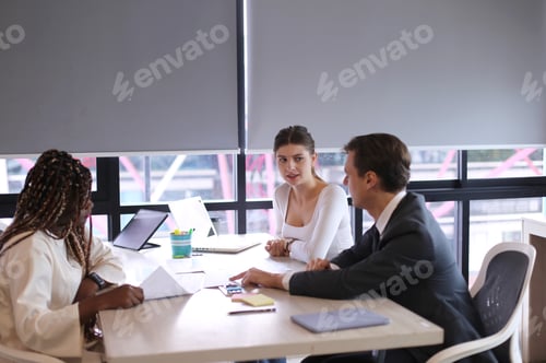 Preview: Shot of a group of businesspeople in a meeting at work