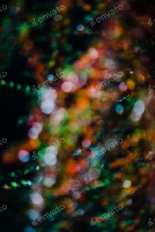Preview: Blurred colorful light shining in dark
