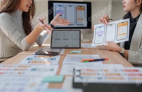 Preview: Designers collaborating on mobile application ui ux new project
