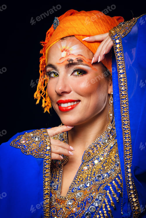 Preview: Portrait Of Eastern Beauty With Face Art And National Costumes. Girl Dressed In Jellabiya And