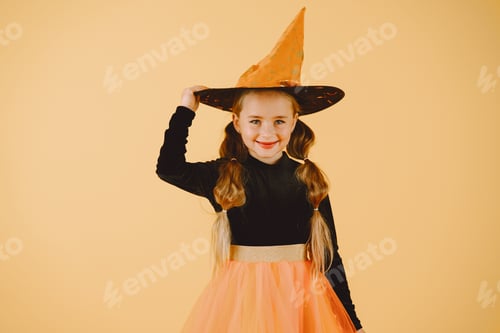 Preview: Smiling Girl in Witch Costume Posing for Halloween