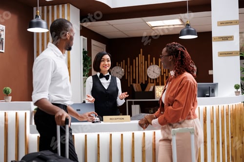 Preview: Asian woman helping guests to check in