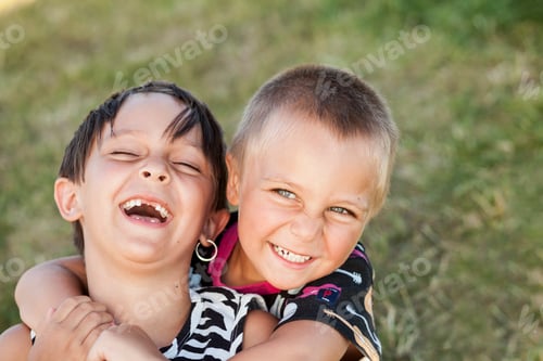 Preview: Happy brother embracing sister in park