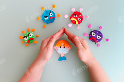 Preview: Clay characters on yellow background with hands of the kid. Care and save concept