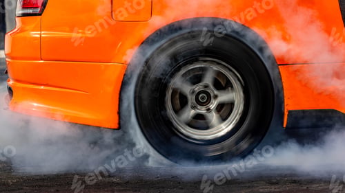 Preview: Car burnout wheels tire with white smoke,Car wheel burnout with smoke from the spinning tyre.
