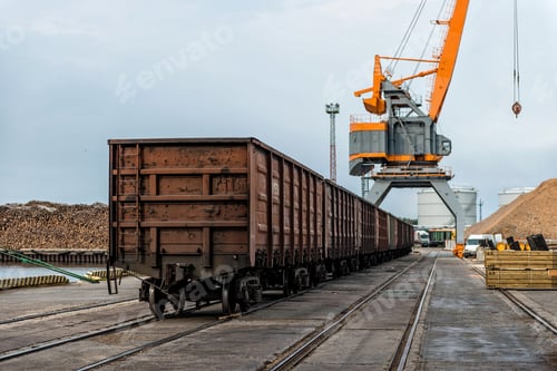 Preview: Harbor cranes and railway freight wagons. ❤️ nominated 💔