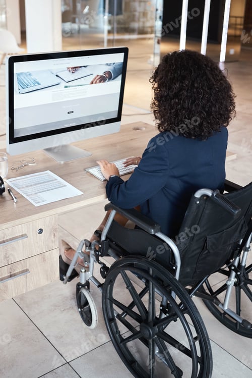 Preview: Business woman, wheelchair and disability of a database administrator working on a computer. Office