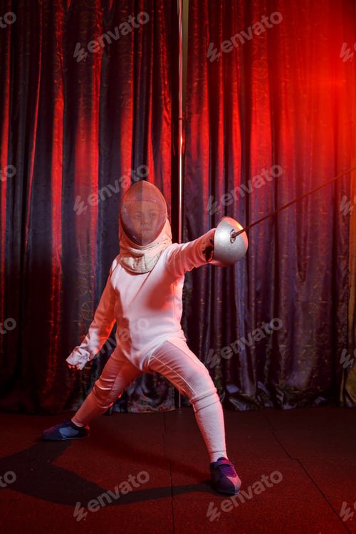 Preview: Girl in a fencing costume with a sword in hand, neon light. A young model trains and trains