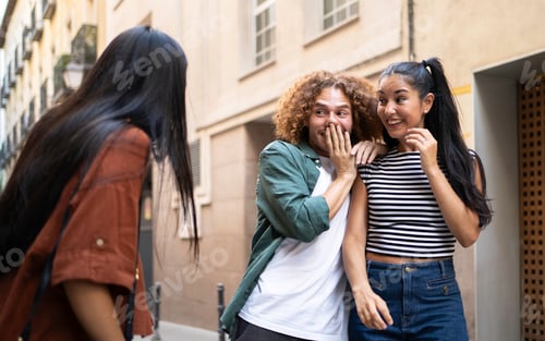 Preview: Friends surprised by someone arriving in the street
