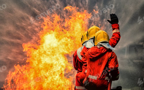Preview: fire fighter team on training with gas and oil fire hold hose spray jet water spray to extinguish