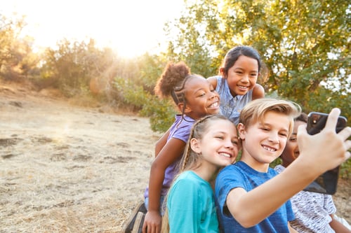 Preview: Group Of Multi-Cultural Children Posing For Selfie With Friends In Countryside Together