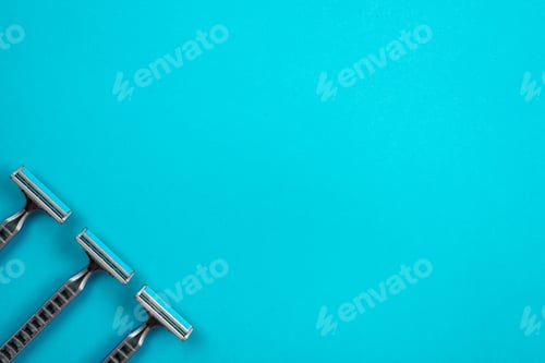 Preview: Razors on a Turquoise Background with Copy Space