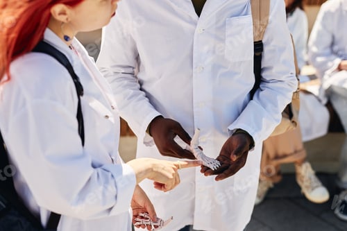 Preview: Medical Students Examining Anatomical Foot Models Together