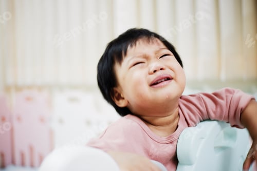 Preview: Portrait of sad baby crying alone in bedroom