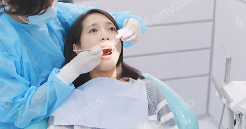 Preview: Woman undergo check up of tooth in dental clinic