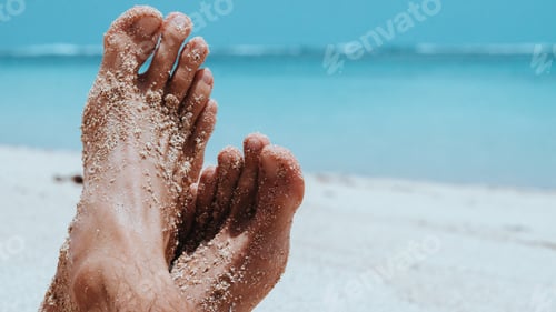 Preview: Male Cross Feet at the Sandy Beach, Ocean in Background, Bali