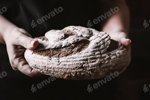 Preview: Closeup shot of hands holding delicious gluten-free bread with chocolate