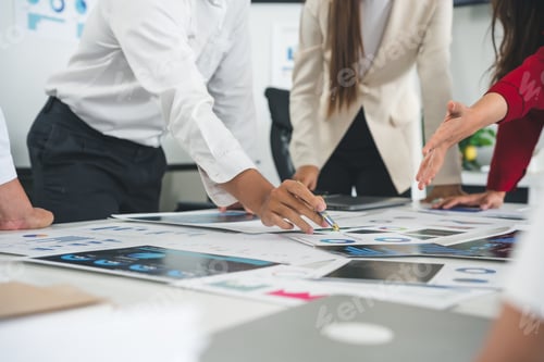 Preview: Business team analyzing financial charts and graphs during a meeting