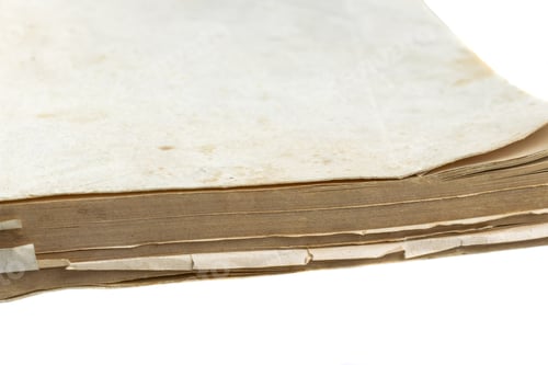 Preview: dirty yellowed page from an old book on a white background