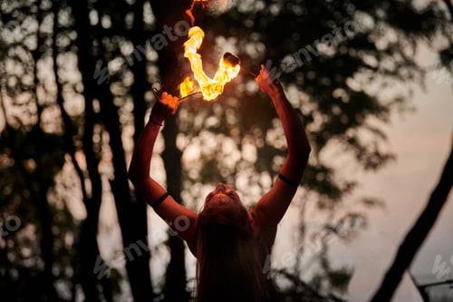 Preview: Girl fire dancing performance at outdoor art festival, smooth movements of female artist