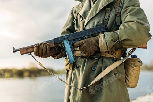 Preview: Soldier Of USA Infantry Of World War II Holds Submachine Weapon In Hands