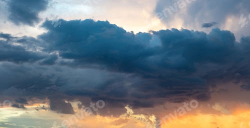 Preview: Twilight light color the cloudy sky. Cloud on blue sky background. Cloudscape grey and orange shade.