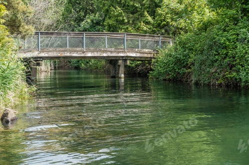 Preview: A View Of A Wooden Walking Bridge At Getn Coulon Park In Renton, Washington.