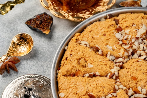 Preview: Turkish pastries and scattered dry fruits on table