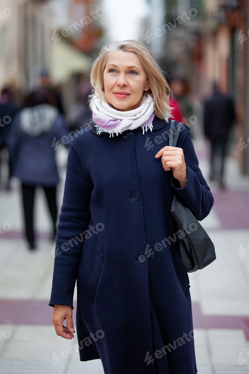 Preview: Happy Pensioner Woman Walks On Streets Of A Tourist City.