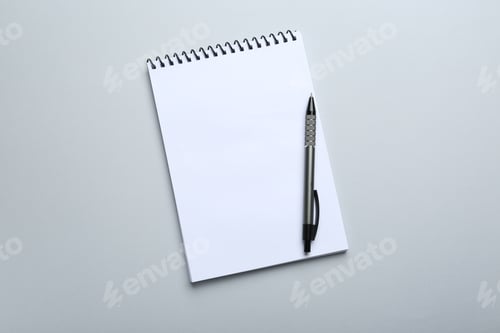 Preview: One notebook and pen on light grey background, top view. Space for text