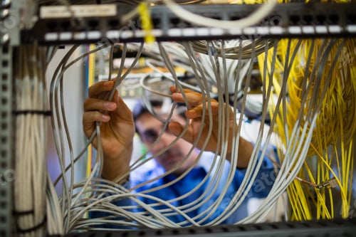 Preview: Technician fixing cable
