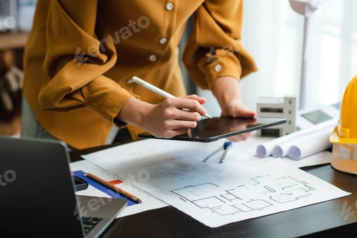 Preview: Architect working with tablet, blueprints, and safety helmet. Modern construction, real estate, and