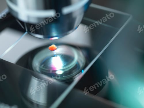 Preview: A light microscope examining a sample in lab for pharmaceutical research