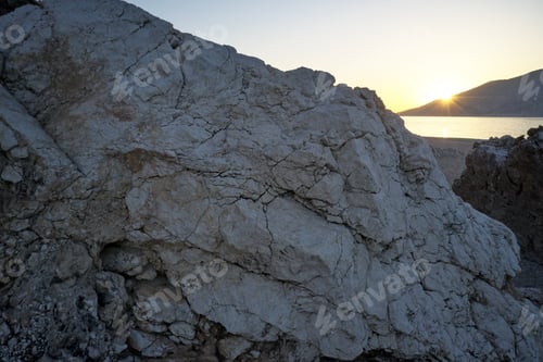 Preview: Close up of big stone on the beach.