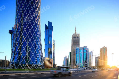 Preview: Long exposure shot of cars on the street with modern high-rise buildings in Doha, Qatar