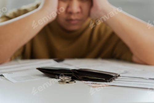 Preview: Worried unemployment man open empty wallet on payday