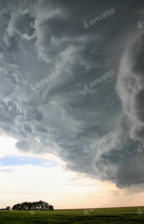 Preview: Dramatic storm clouds over a green field