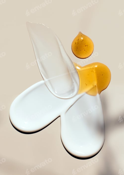 Preview: creamy texture of cosmetic samples on a pastel beige background