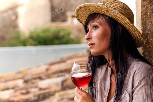 Preview: Woman with Wine Resting in Old World Town