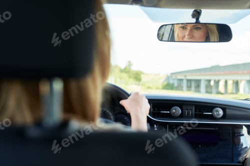 Preview: Caucasian blonde woman driving a car