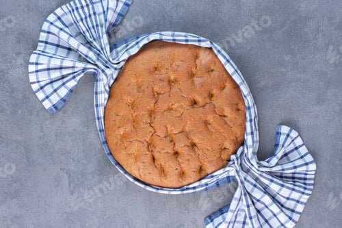 Preview: Tablecloth around a round loaf of bread on marble background