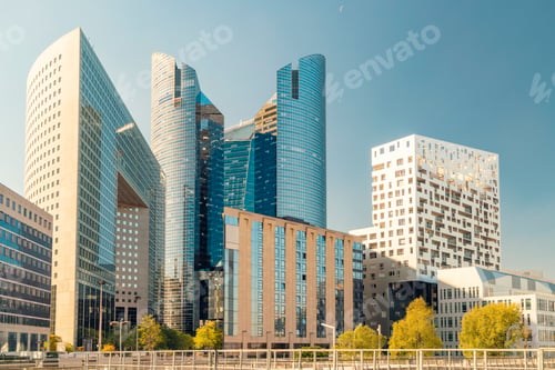 Preview: Modern skyscrapers at La Defense with reflective glass facades towering above a cityscape