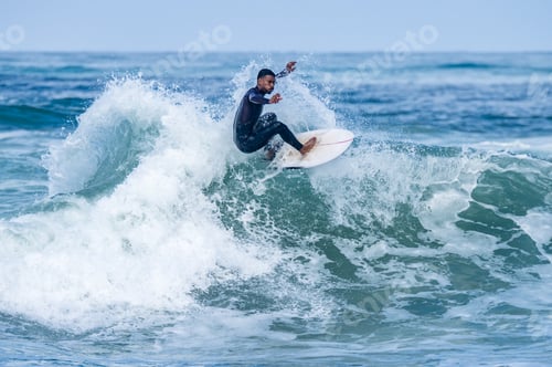 Preview: Surfer riding waves in Furadouro Beach