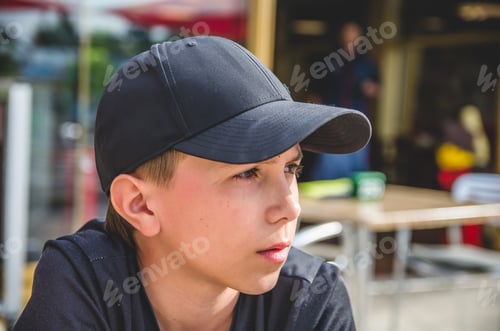 Preview: Teen boy in black baseball cap