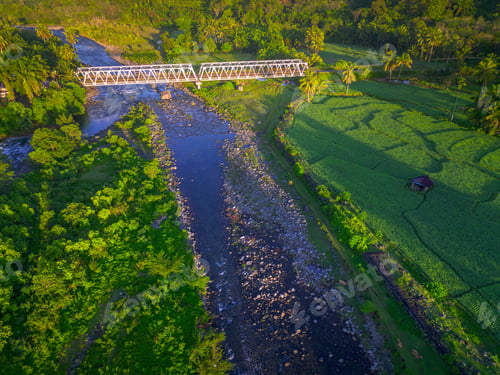 Preview: Beautiful morning view in Indonesia, panoramic landscape of rice fields with mountain ranges