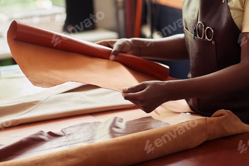 Preview: Female Artisan Choosing Leather Closeup