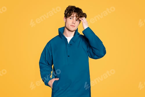 Preview: Man in jacket isolated on yellow background