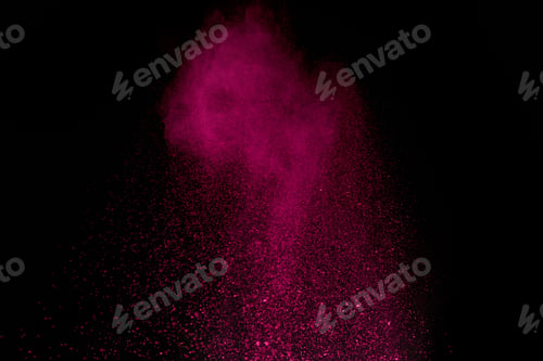 Preview: pink holi powder in air on black background