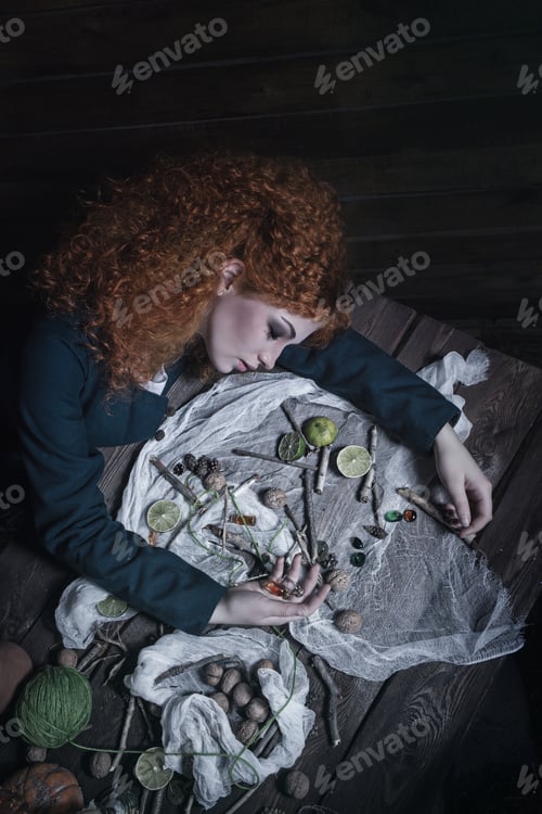 Preview: The Red-Haired Witch Preparing A Potion From A Variety Of Ingredients, Spread On A Wooden Table