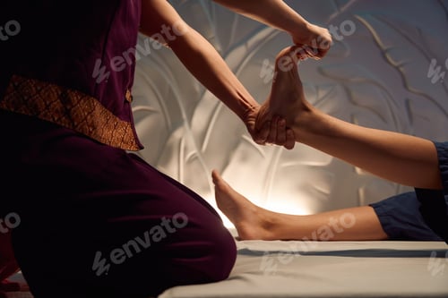 Preview: Spa salon masseuse giving relaxing feet massage to client